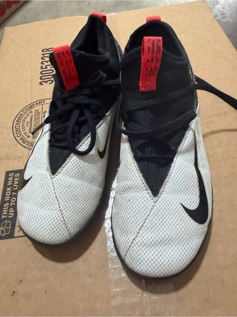 Nike Youth White and Black Athletic Trainers with Red Pull Tabs